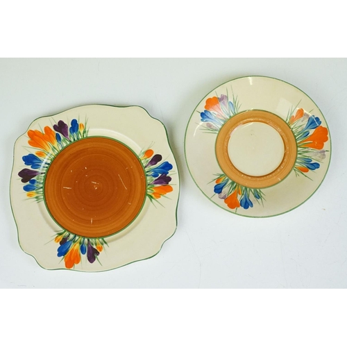 32 - Three Clarice Cliff 'Crocus' pattern trios to include a Wilkinson Pottery 'Bizarre' trio, Royal Staf... 