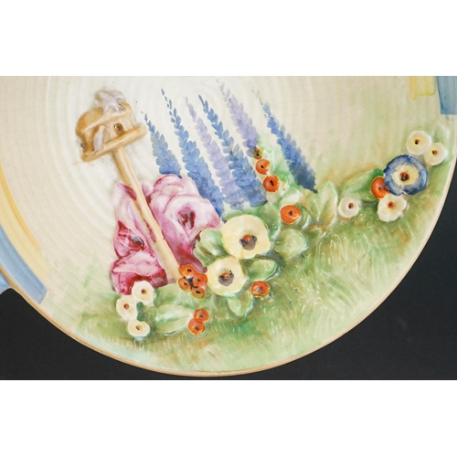 35 - Art Deco Royal Winton Dish with moulded decoration of a Birds and a Bird Table in a Garden, 23cm dia... 