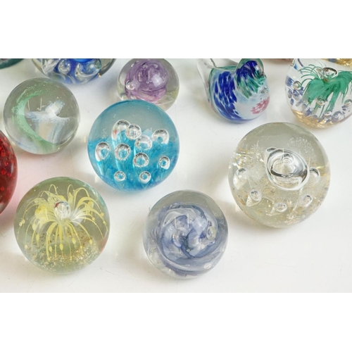 57 - Collection of 24 glass paperweights featuring a boxed QEII Diamond Jubilee paperweight, Alum Bay, mi... 