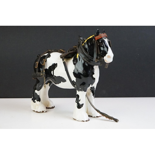 65 - Beswick - A Beswick Piebald Shire Mare with harness (appears overpainted, 21.5cm high), together wit... 