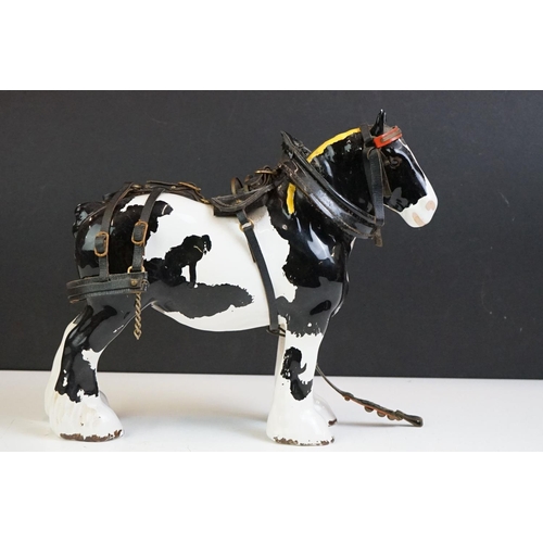 65 - Beswick - A Beswick Piebald Shire Mare with harness (appears overpainted, 21.5cm high), together wit... 