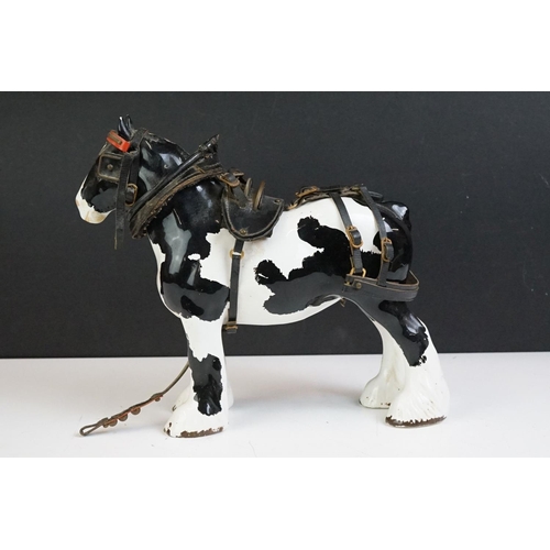 65 - Beswick - A Beswick Piebald Shire Mare with harness (appears overpainted, 21.5cm high), together wit... 