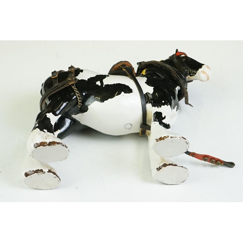 65 - Beswick - A Beswick Piebald Shire Mare with harness (appears overpainted, 21.5cm high), together wit... 