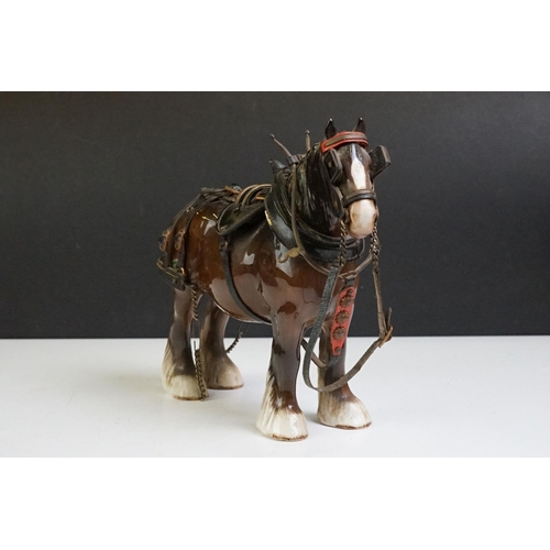 65 - Beswick - A Beswick Piebald Shire Mare with harness (appears overpainted, 21.5cm high), together wit... 