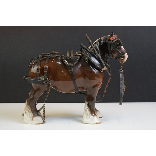 65 - Beswick - A Beswick Piebald Shire Mare with harness (appears overpainted, 21.5cm high), together wit... 