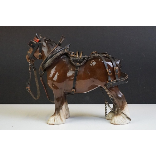 65 - Beswick - A Beswick Piebald Shire Mare with harness (appears overpainted, 21.5cm high), together wit... 