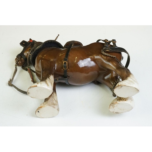 65 - Beswick - A Beswick Piebald Shire Mare with harness (appears overpainted, 21.5cm high), together wit... 