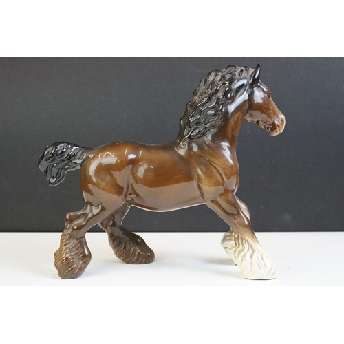 65 - Beswick - A Beswick Piebald Shire Mare with harness (appears overpainted, 21.5cm high), together wit... 