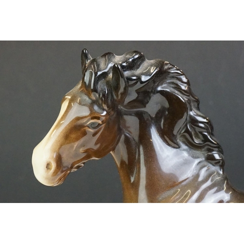 65 - Beswick - A Beswick Piebald Shire Mare with harness (appears overpainted, 21.5cm high), together wit... 