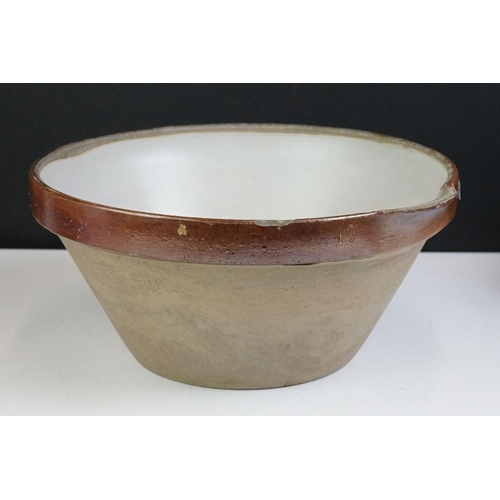 83 - Two late 19th / early 20th century stoneware dairy bowls (largest 29.5cm diameter), together with a ... 