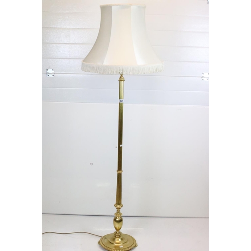 638 - 20th century Brass Corinthian Column Standard Lamp raised on a circular base with four feet, with sh... 