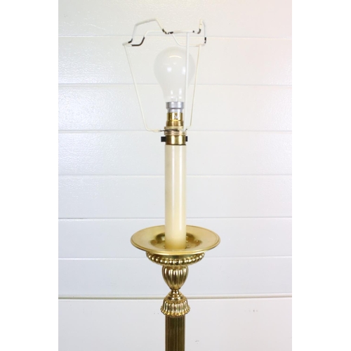 638 - 20th century Brass Corinthian Column Standard Lamp raised on a circular base with four feet, with sh... 