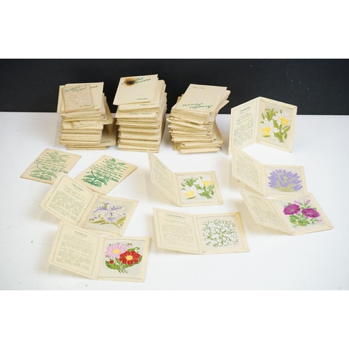 A collection of Kensitas Flowers silk cigarette cards all within card  sleeves.