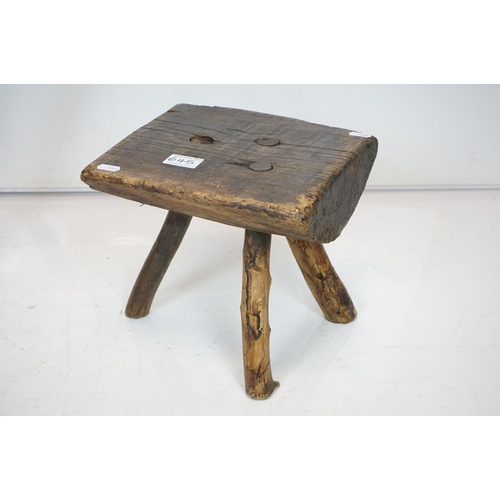 645 - Two Rustic Vernacular Stools, the smaller raised on three legs, largest stool measures 54cm long x 3... 