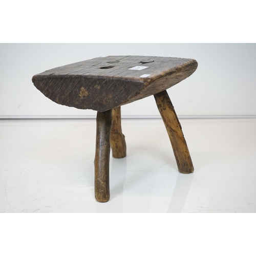 645 - Two Rustic Vernacular Stools, the smaller raised on three legs, largest stool measures 54cm long x 3... 