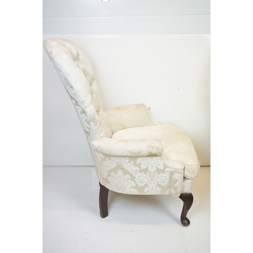 648 - Pair of Victorian style Button Back Armchairs upholstered in cream fabric, raised on front cabriole ... 