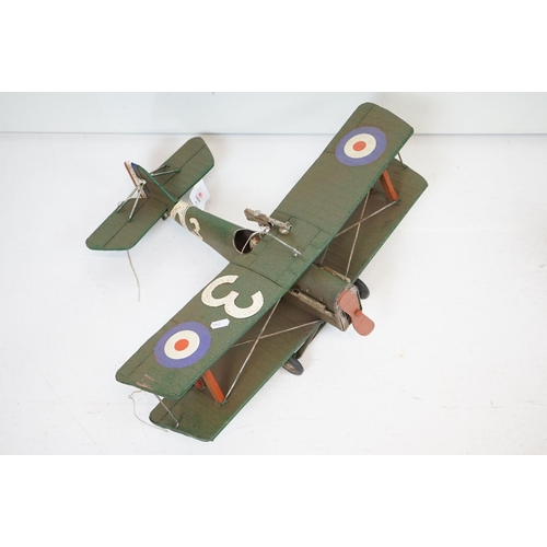 384 - A tinplate model of the Red Baron's Fokker trio plane, finish in red with iron cross insignia togeth... 