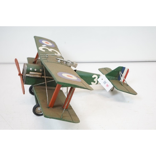 384 - A tinplate model of the Red Baron's Fokker trio plane, finish in red with iron cross insignia togeth... 