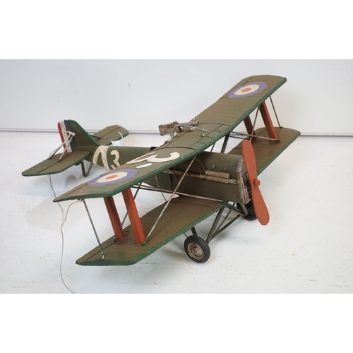 384 - A tinplate model of the Red Baron's Fokker trio plane, finish in red with iron cross insignia togeth... 