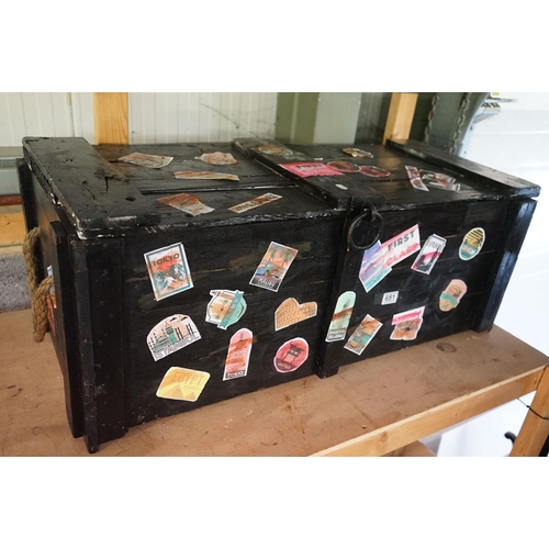 651 - Black Painted Wooden Trunk / Box with applied replica travel stickers, 95cm long x 37cm high