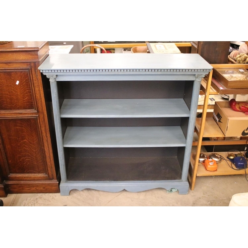 650 - Open front bookcase with Corinthian columns and fitted shelves.