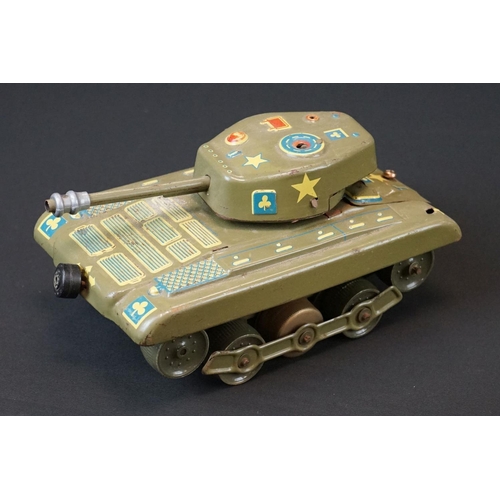 384 - Three play worn mid 20th C tin plate models to include Gama T99 Tank (missing a wheel), Western Germ... 