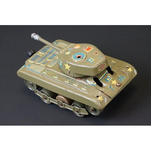 384 - Three play worn mid 20th C tin plate models to include Gama T99 Tank (missing a wheel), Western Germ... 