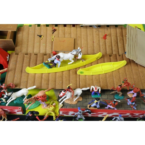 375 - Around 40 plastic figures, mainly Timpo Toys Wild West examples, featuring canoes, cowboys & mounted... 