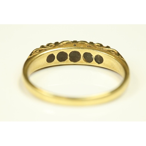 103 - Sapphire and diamond 18ct yellow gold five stone ring, small round mixed cut stones, claw set, scrol... 