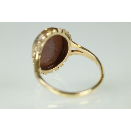 112 - Cameo 9ct yellow gold ring, size O; a 9ct gold Star of David pendant; a 9ct gold heart shaped pendan... 