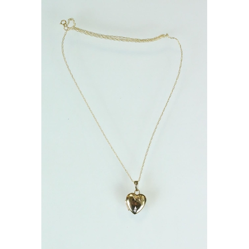 116 - 9ct yellow gold heart-shaped locket pendant, fine link 9ct chain; together with a 9ct gold front and... 