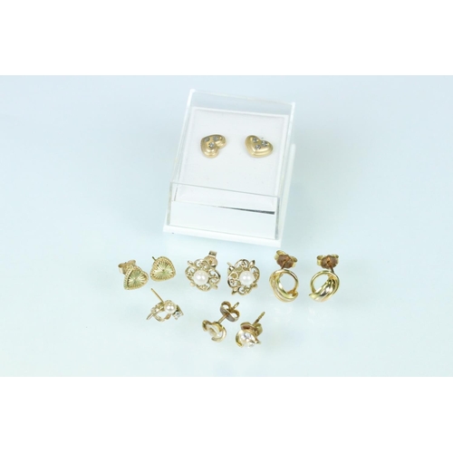 117 - Two pairs of 9ct gold stud earrings together with three pairs of yellow metal earrings (q)