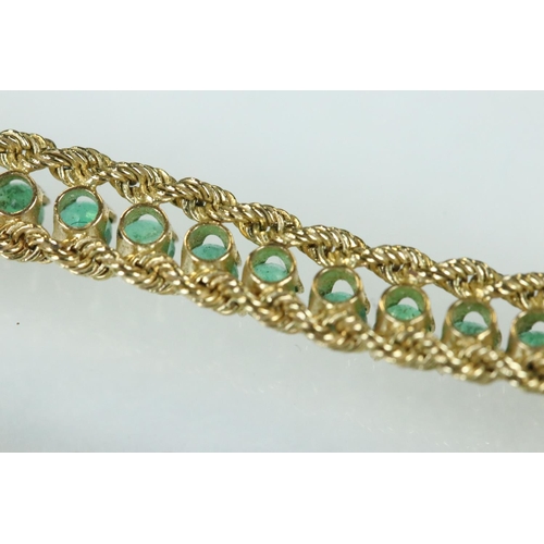 92 - Emerald 14ct yellow gold line bracelet, fifty-four small round mixed cut emeralds, claw set, rope tw... 