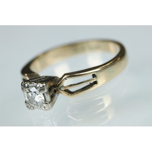 93 - Diamond solitaire 14ct yellow gold and white gold set ring, the small round brilliant cut diamond we... 