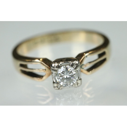 93 - Diamond solitaire 14ct yellow gold and white gold set ring, the small round brilliant cut diamond we... 