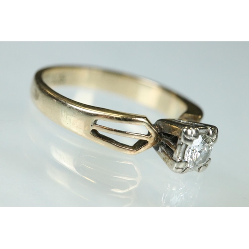 93 - Diamond solitaire 14ct yellow gold and white gold set ring, the small round brilliant cut diamond we... 