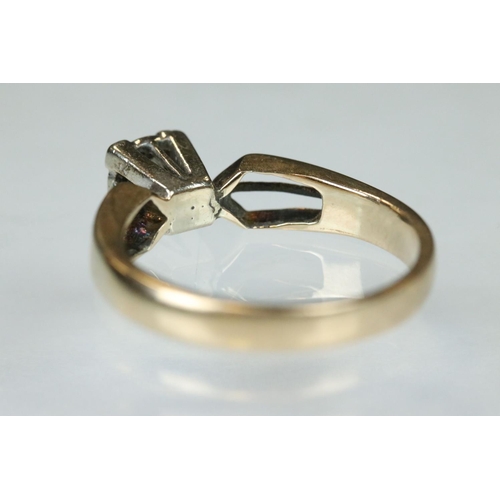 93 - Diamond solitaire 14ct yellow gold and white gold set ring, the small round brilliant cut diamond we... 
