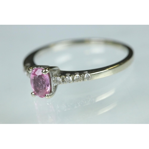 94 - Pink sapphire and diamond 18ct white gold ring, the oval mixed cut pink sapphire measuring approx 5.... 