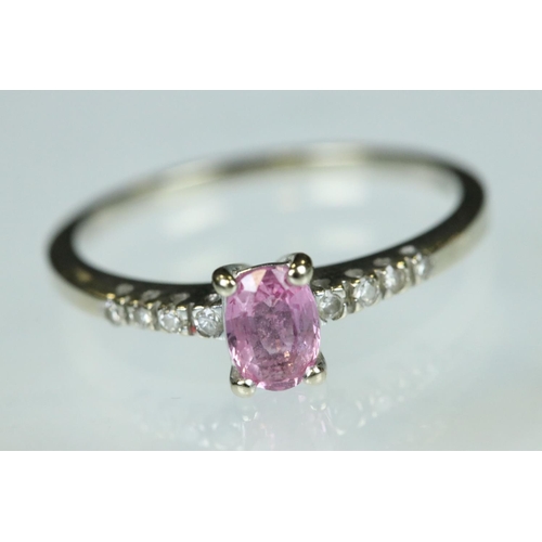94 - Pink sapphire and diamond 18ct white gold ring, the oval mixed cut pink sapphire measuring approx 5.... 