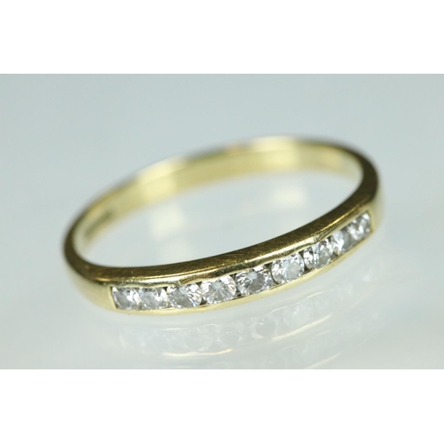95 - Diamond 18ct yellow gold ring, nine small round brilliant cut diamonds, channel set, ring size Q