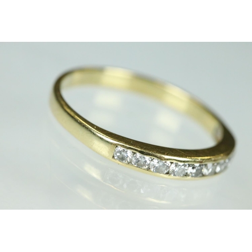 95 - Diamond 18ct yellow gold ring, nine small round brilliant cut diamonds, channel set, ring size Q