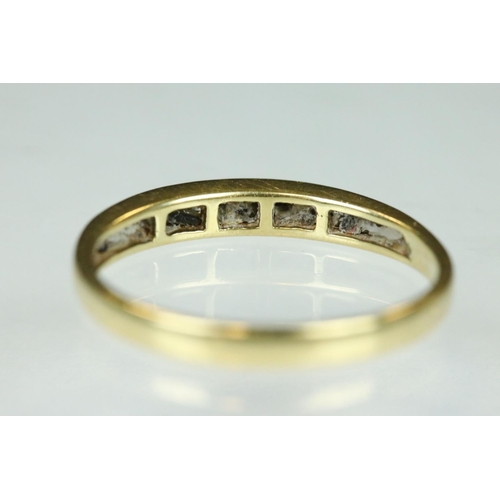 95 - Diamond 18ct yellow gold ring, nine small round brilliant cut diamonds, channel set, ring size Q