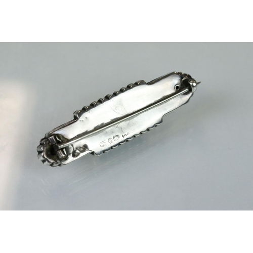 97 - 19th century blue lace agate unmarked silver brooch, the oval design with buckle detail and engraved... 