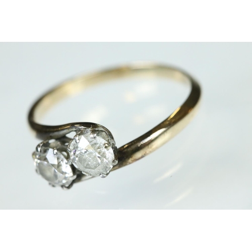 98 - Diamond two stone unmarked yellow and white gold set ring, two round brilliant cut diamonds, each we... 