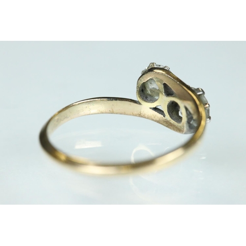 98 - Diamond two stone unmarked yellow and white gold set ring, two round brilliant cut diamonds, each we... 
