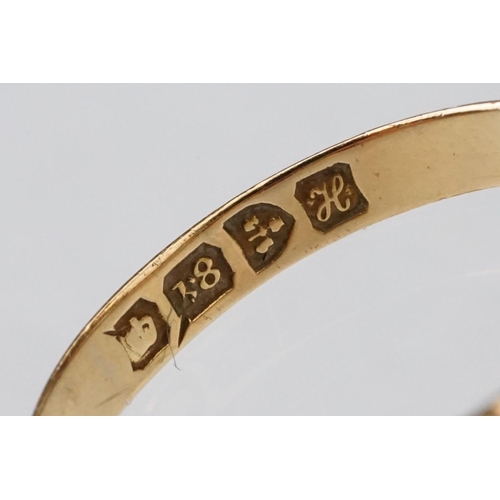 22 - Early 20th century ruby and diamond 18ct yellow gold ring, three graduated  round mixed cut rubies, ... 