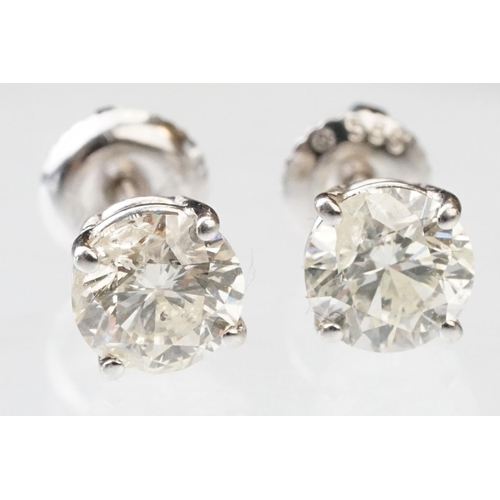 41 - Pair of diamond solitaire 14ct white gold stud earrings, modern round brilliant cut diamond, each we... 