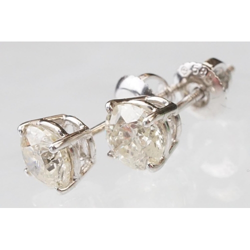 41 - Pair of diamond solitaire 14ct white gold stud earrings, modern round brilliant cut diamond, each we... 
