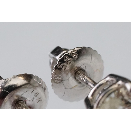 41 - Pair of diamond solitaire 14ct white gold stud earrings, modern round brilliant cut diamond, each we... 