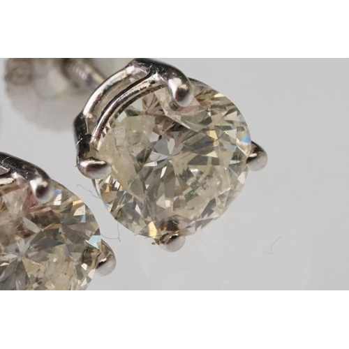 41 - Pair of diamond solitaire 14ct white gold stud earrings, modern round brilliant cut diamond, each we... 